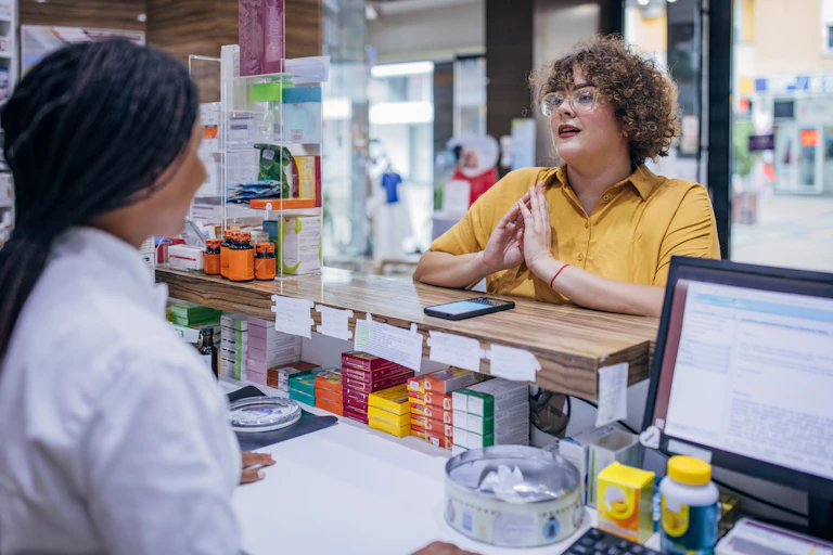 Woman talks to pharmacist