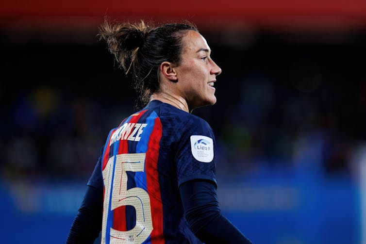 Lucy Bronze smiles during the match.
