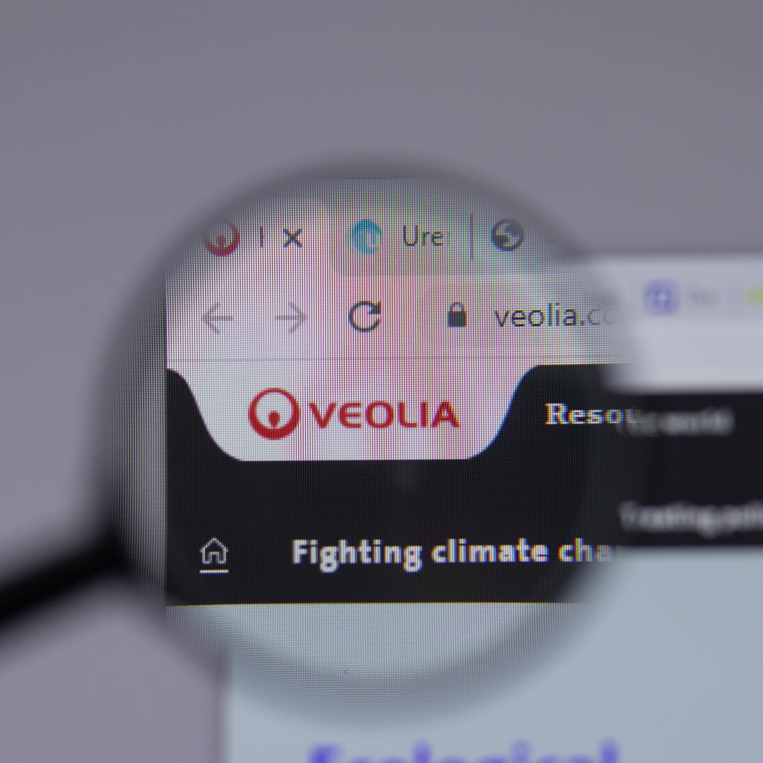 The red logo of the Veolia group appears above the words "Fighting climate" and what appears to be half of the word "change".