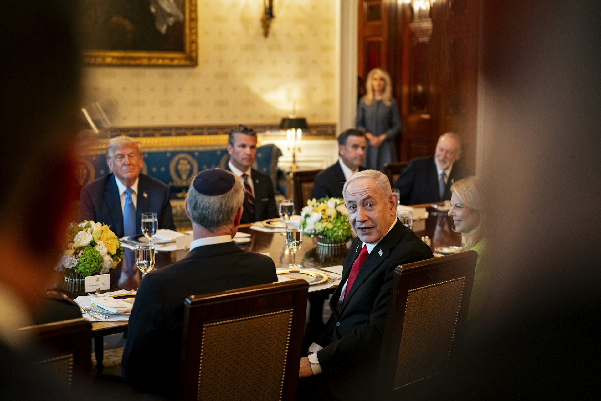 Benjamin Netanyahu seated opposite Donald Trump at an official dinner at the White House