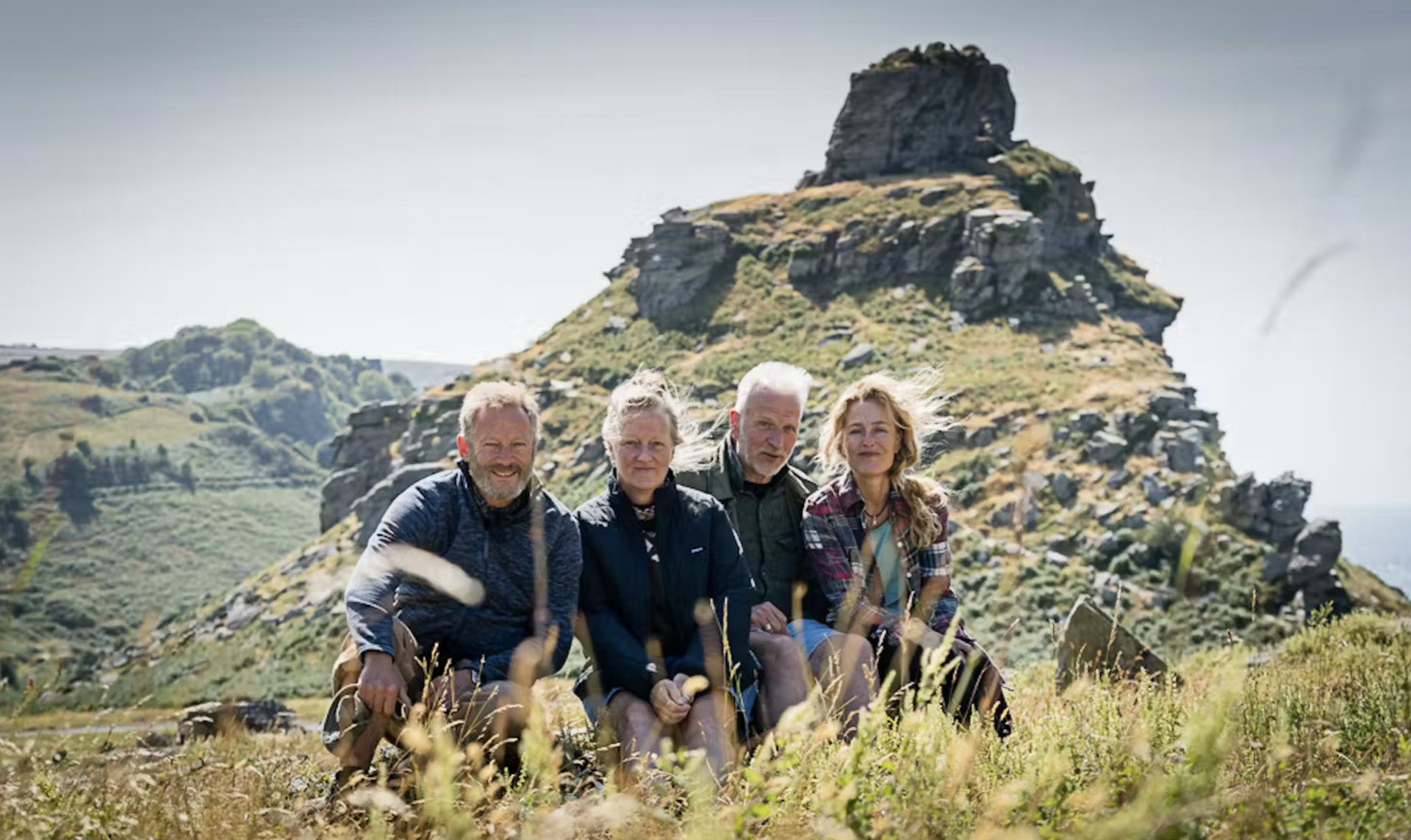 Jason Isaacs (left), Raynor Winn, Moth Winn and Gillian Anderson on the south coast during the filming of The Salt Path.