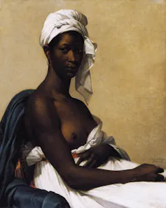 Portrait of a black woman wrapped in white cloth