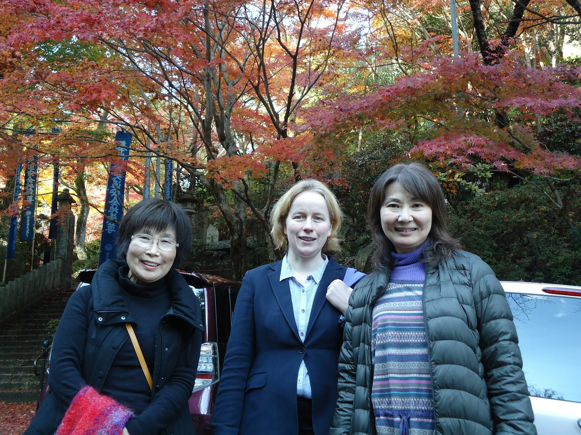 Three women outside a temple in Japan