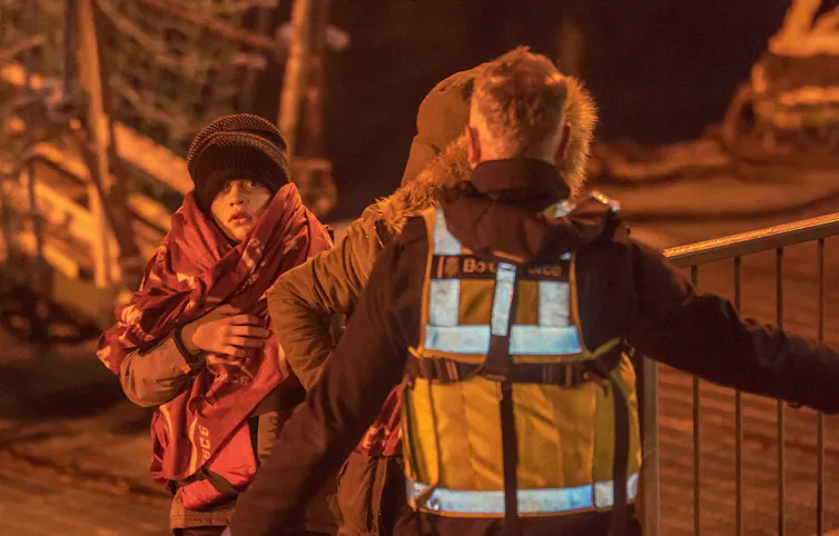 A young child at Dover docks after being picked up in the Channel.