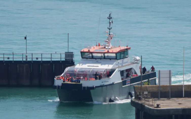 Border Force vessel full of people in red life jackets