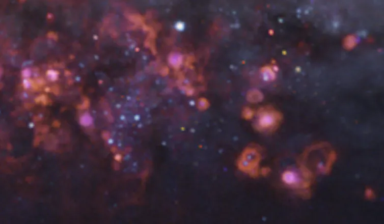 Clouds of gas punctuated by bright dots which represent stars.
