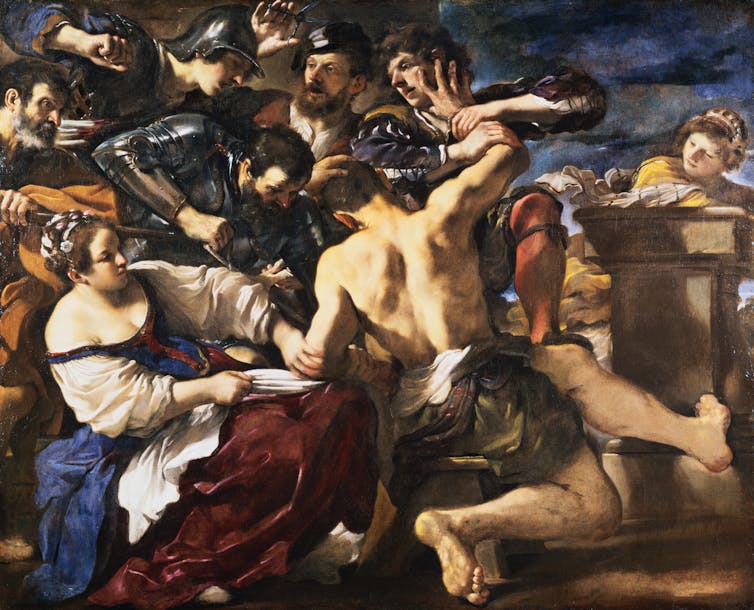 A painting showing a man with a bare upper body surrounded by several men and women trying to hold him.