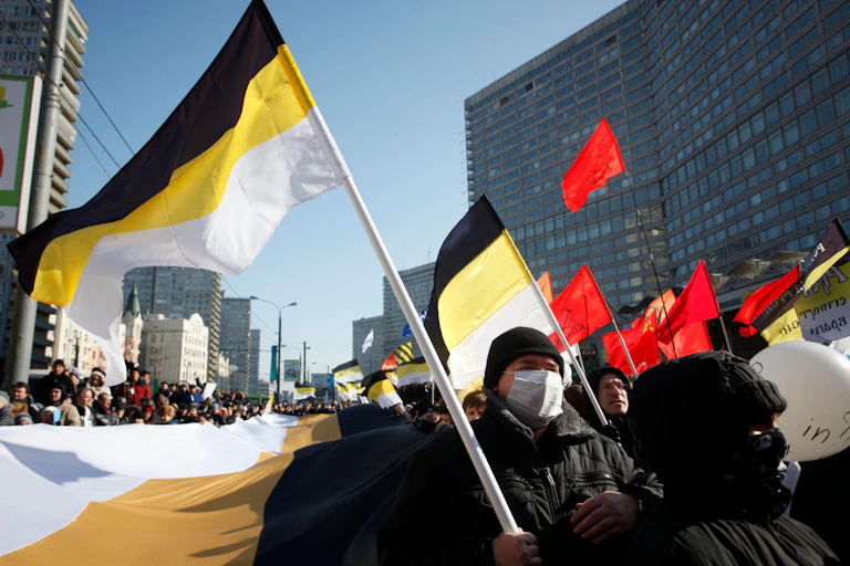 A group of Russian nationalists waving Russian imperial flags during a protest.