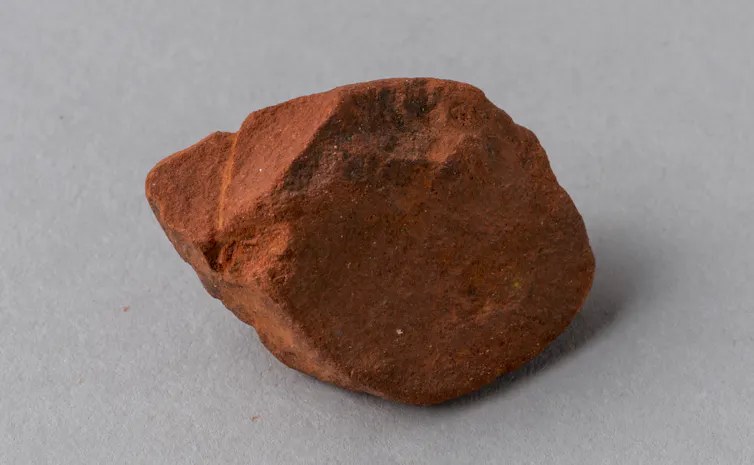 lump of reddish crumbly rock
