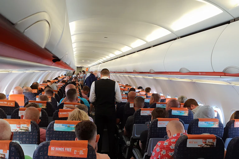 Passengers seated on a plane.