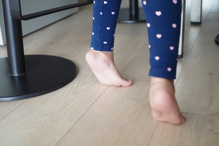 Child walks on tip-toes