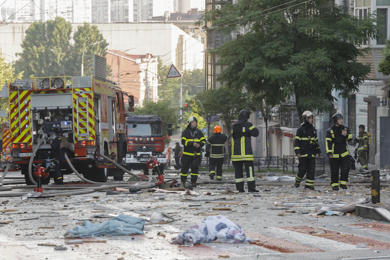 Rescue workers at the site of an apartment building attacked by Russia July 10 2025.