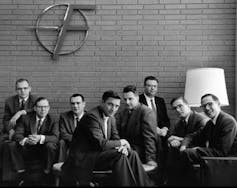 The 'traitorous eight' group of employees sat at a table.