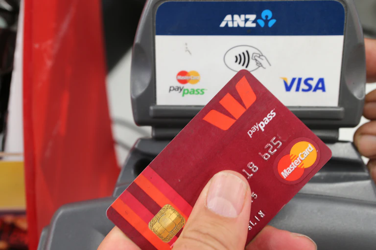 Unidentified hand holding credit card