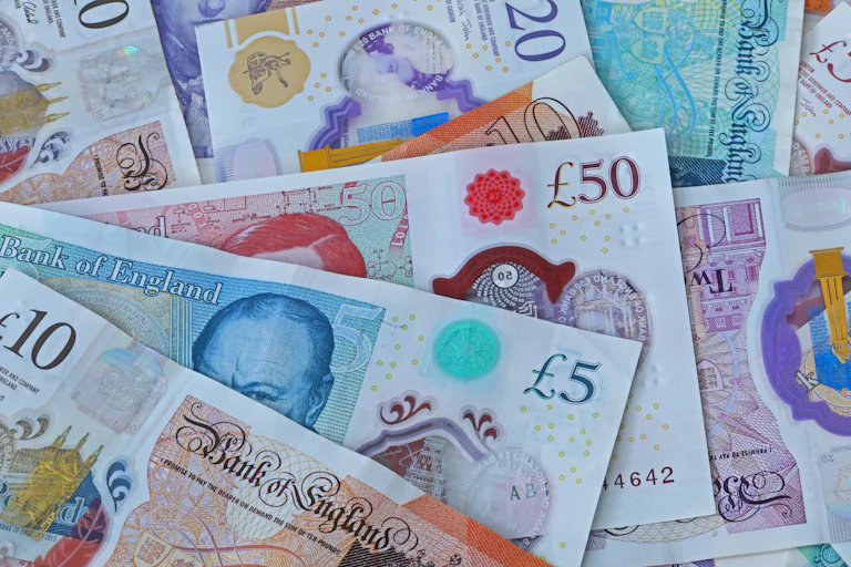 British notes lying on top of each other