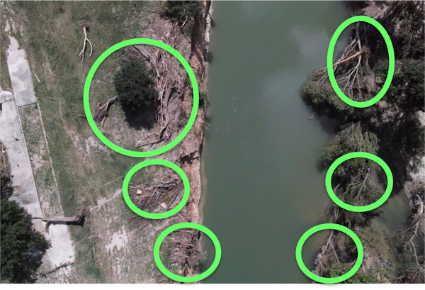 aerial view of a landscape with green rings superimposed