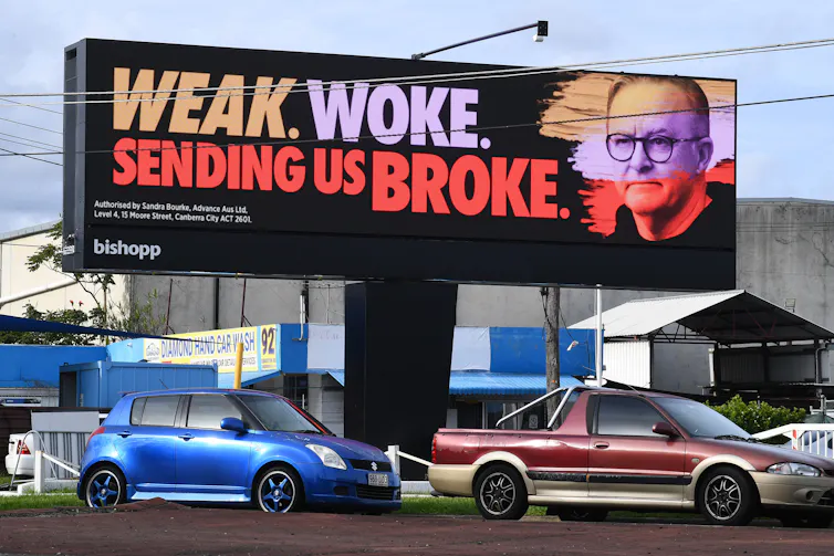 A billboard with Anthony Albanese's face saying weak, woke and sending us broke.
