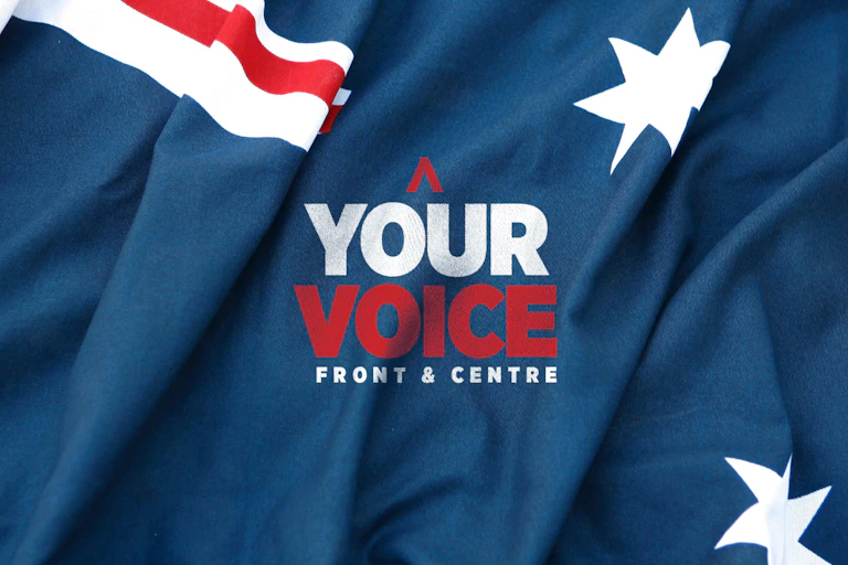 An Australian flag with the words your voice front and centre