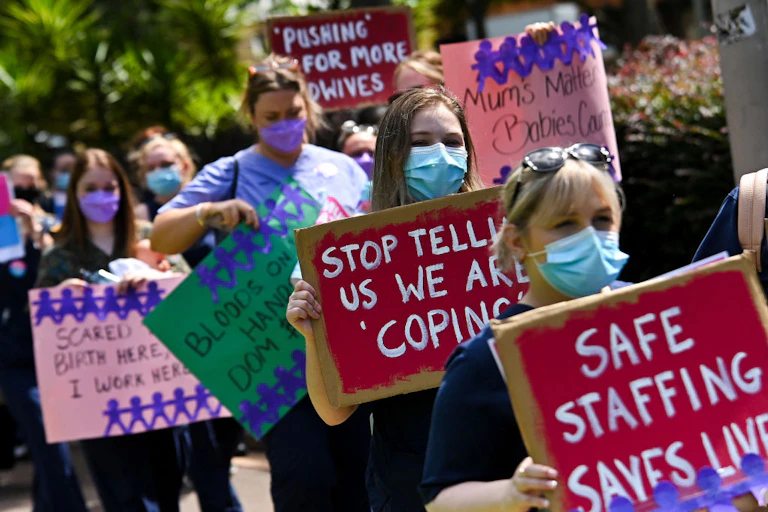 Midwives on strike, NSW, Australia holding placards