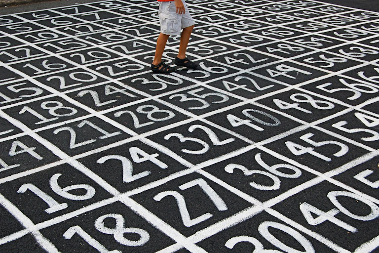 Person walking on a surface of numbers