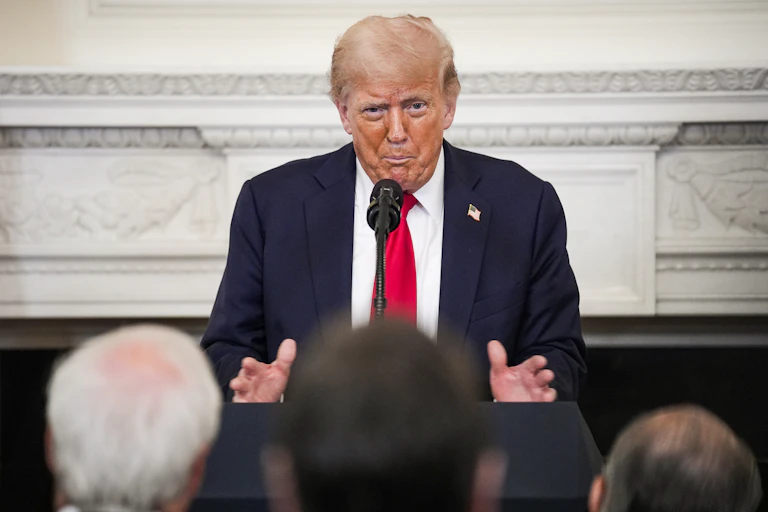 Trump speaking at a press conference.