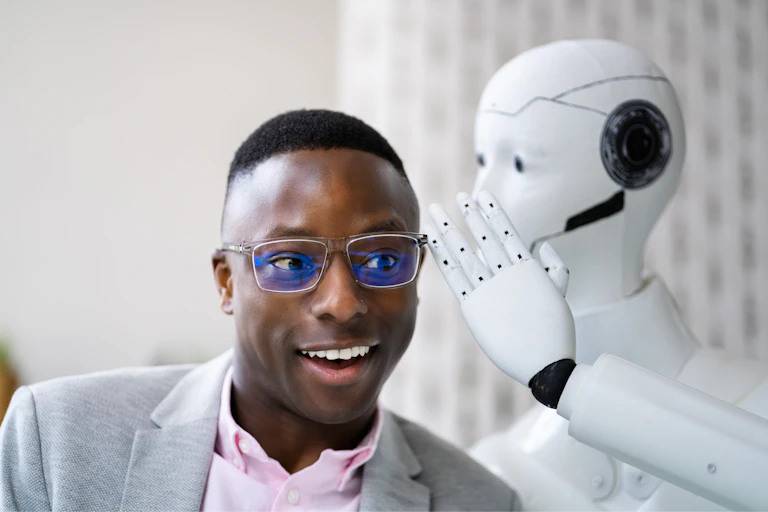 Robot whispers to smiling man