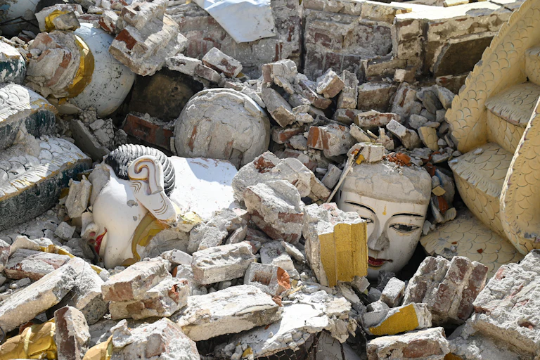 This photo shows damaged Buddha statues surrounded by the debris of a collapsed building in Mandalay, following the devastating March 28 Myanmar earthquake.