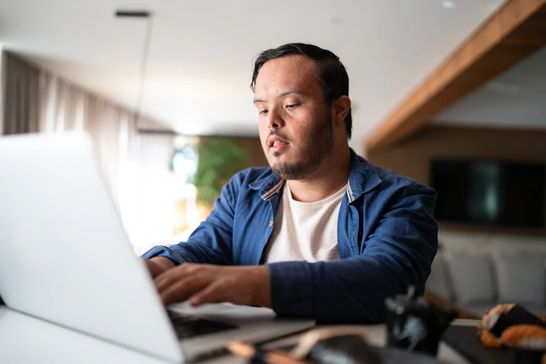 An NDIS user types at his computer
