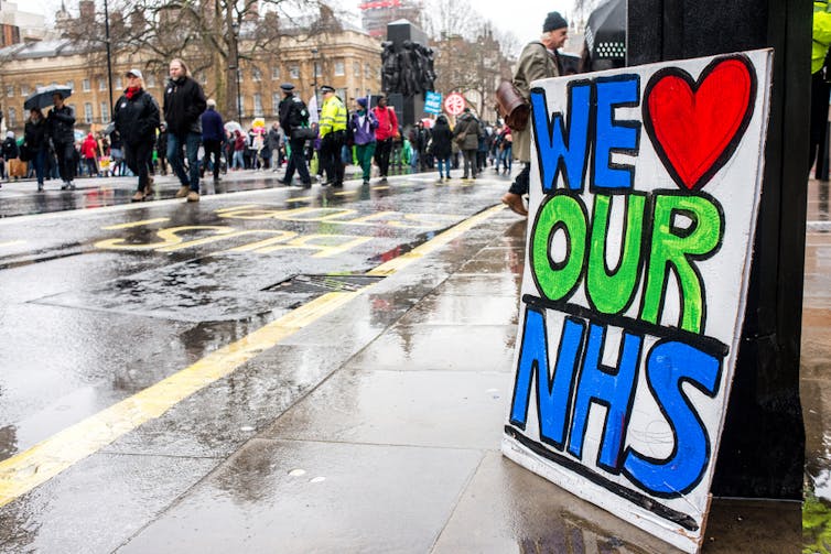 Placard on street expressing love for the NHS.