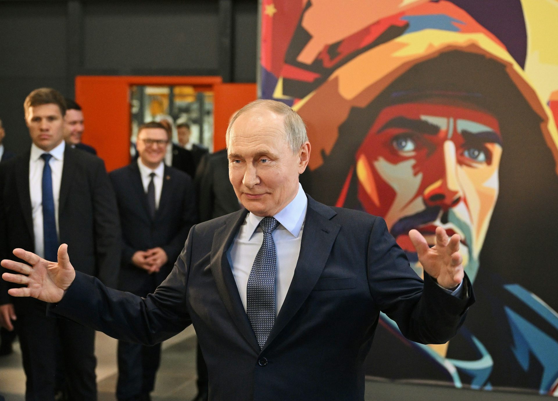Vladimir Putin gestures with his arms wide as he visits the Magnitogorsk Iron and Steel Works in the Urals, July 16 2025.