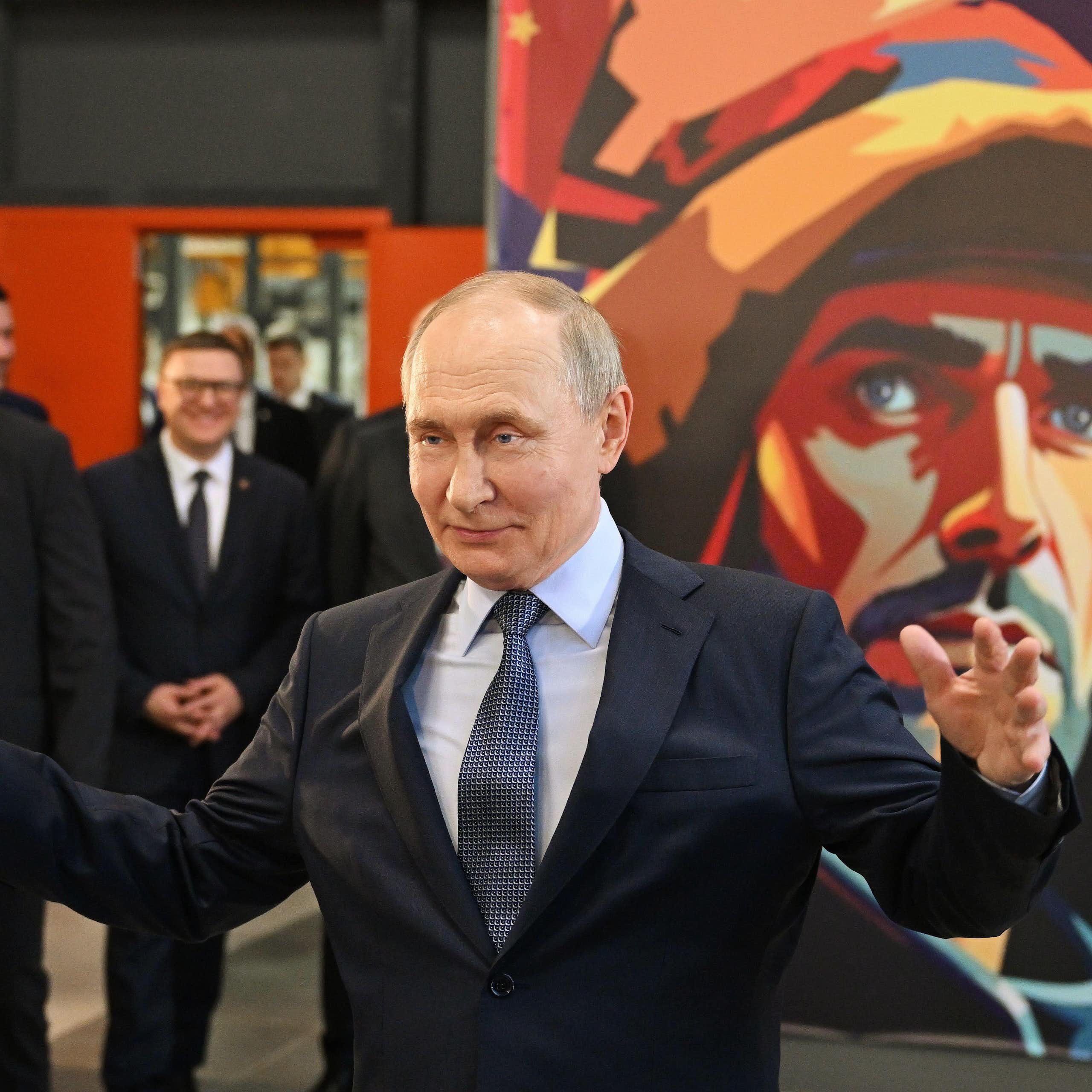 Vladimir Putin gestures with his arms wide as he visits the Magnitogorsk Iron and Steel Works in the Urals, July 16 2025.
