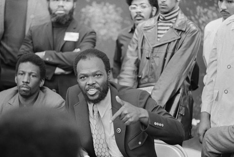 A man gesticulates while talking