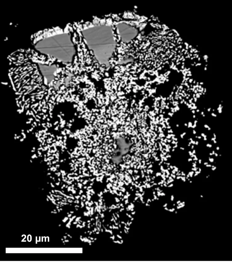 white scattered fragments against a black background