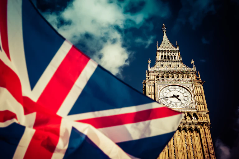 A union flag and the House of Parliament.