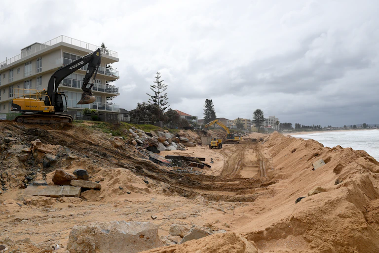 Building a sea wall in an area prone to coastal erosion, at Collaroy beach in Sydney, Friday, March 19, 2021