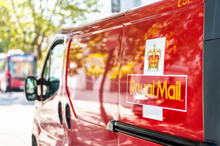 red royal mail van showing the logo on the side.