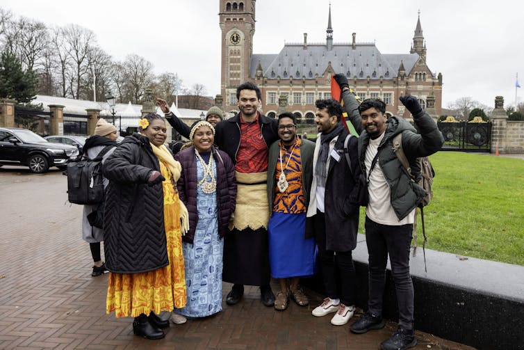 Representatives from Pacific island nations gathered outside the International Court of Justice during the hearings.