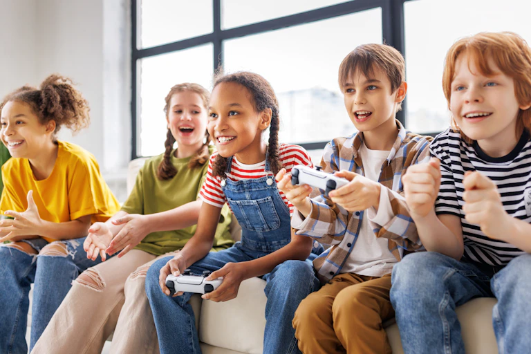Five happy children playing video games