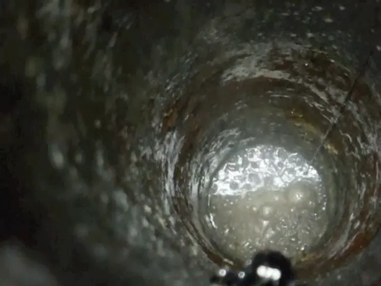 bubbles moving through a grey tunnel