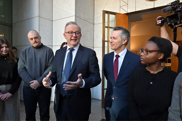 Prime Minister Anthony Albanese and Education Minister Jason Clare with young people at Parliament House in Canberra.