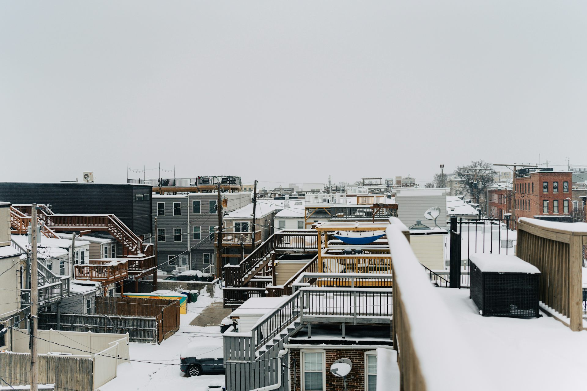 residential rooftops covered in snow