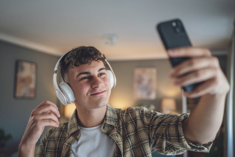 Teenage boy taking selfie