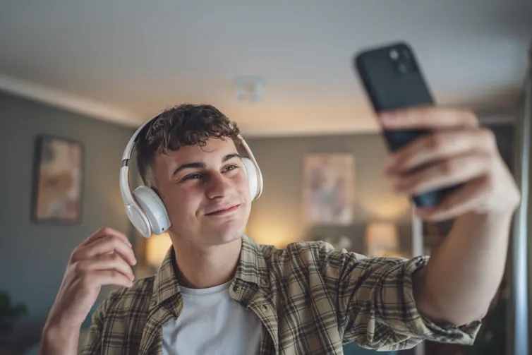 Teenage boy taking selfie