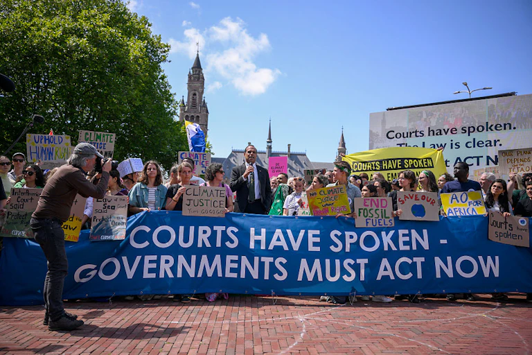 Vanuatu's Climate Change Minister Ralph Regenvanu delivers a speech as he attends a demonstration ahead of the International Court of Justice session in The Hague on July 23, 2025.