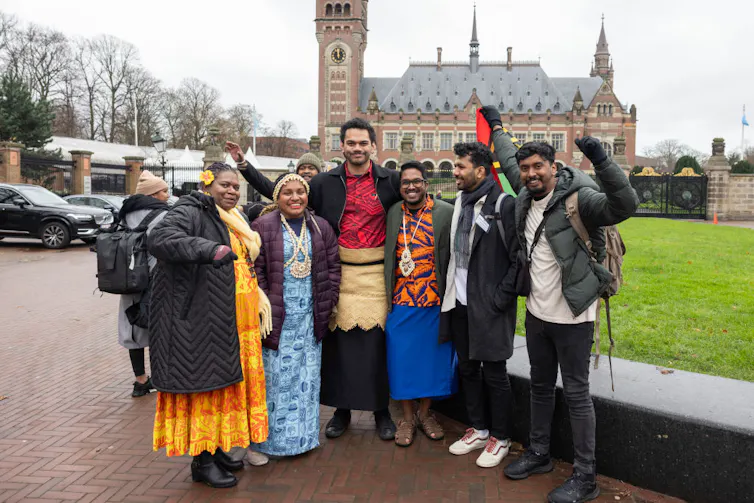 Group of Pacific Islanders looking happy