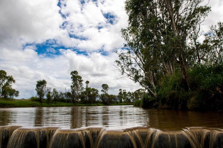 River water spills over the edge of Yarramalong Weir in the Murray-Darling Basin.
