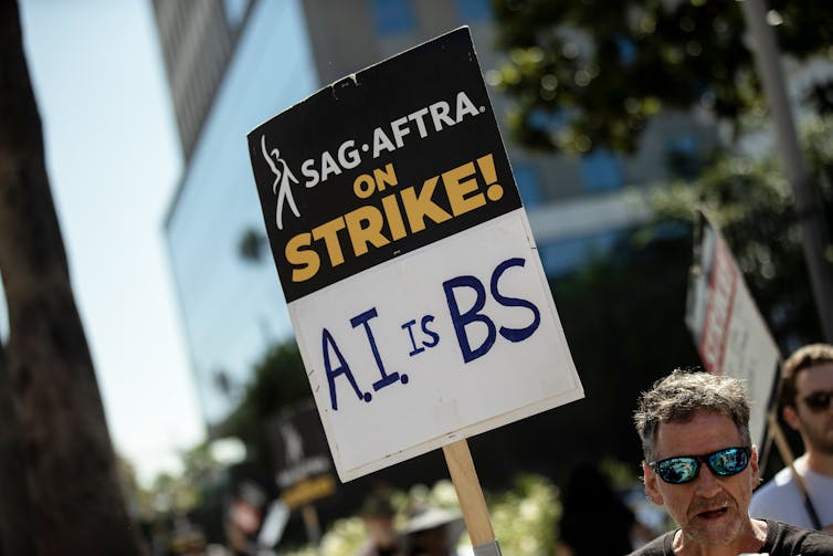 A protest sign that reads 'AI is BS'
