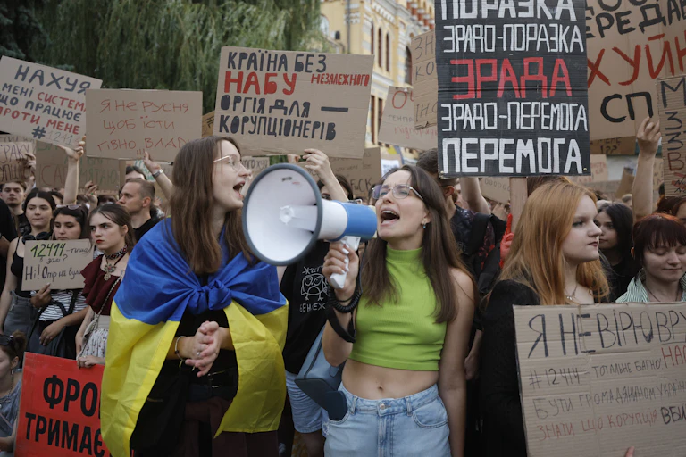 Ukrainian people attend a protest.