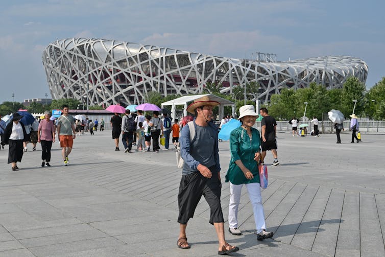 People visit the National Stadium, known as the Bird's Nest, in Beijing