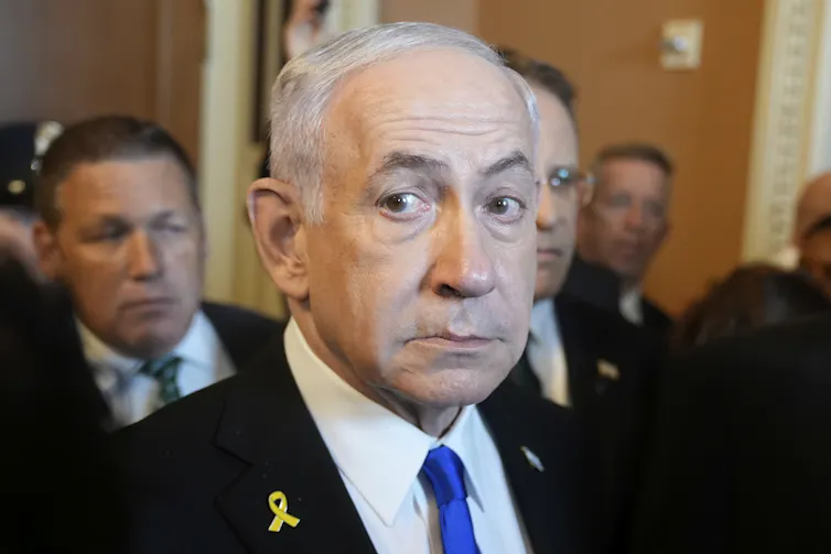 Benjamin Netanyahu surrounded by other people